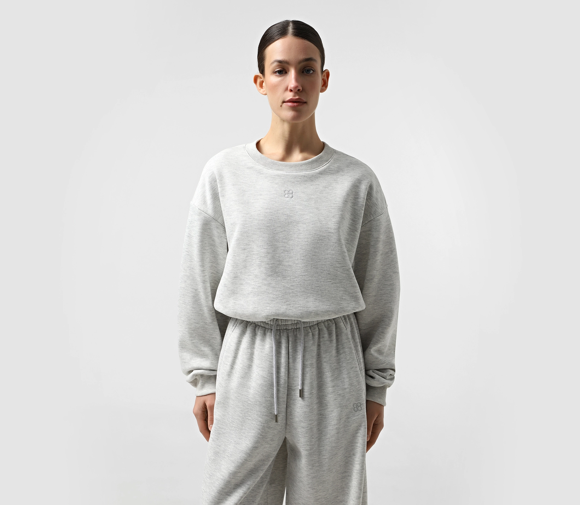 Костюм утеплений з лого світло-сірий меланж фото