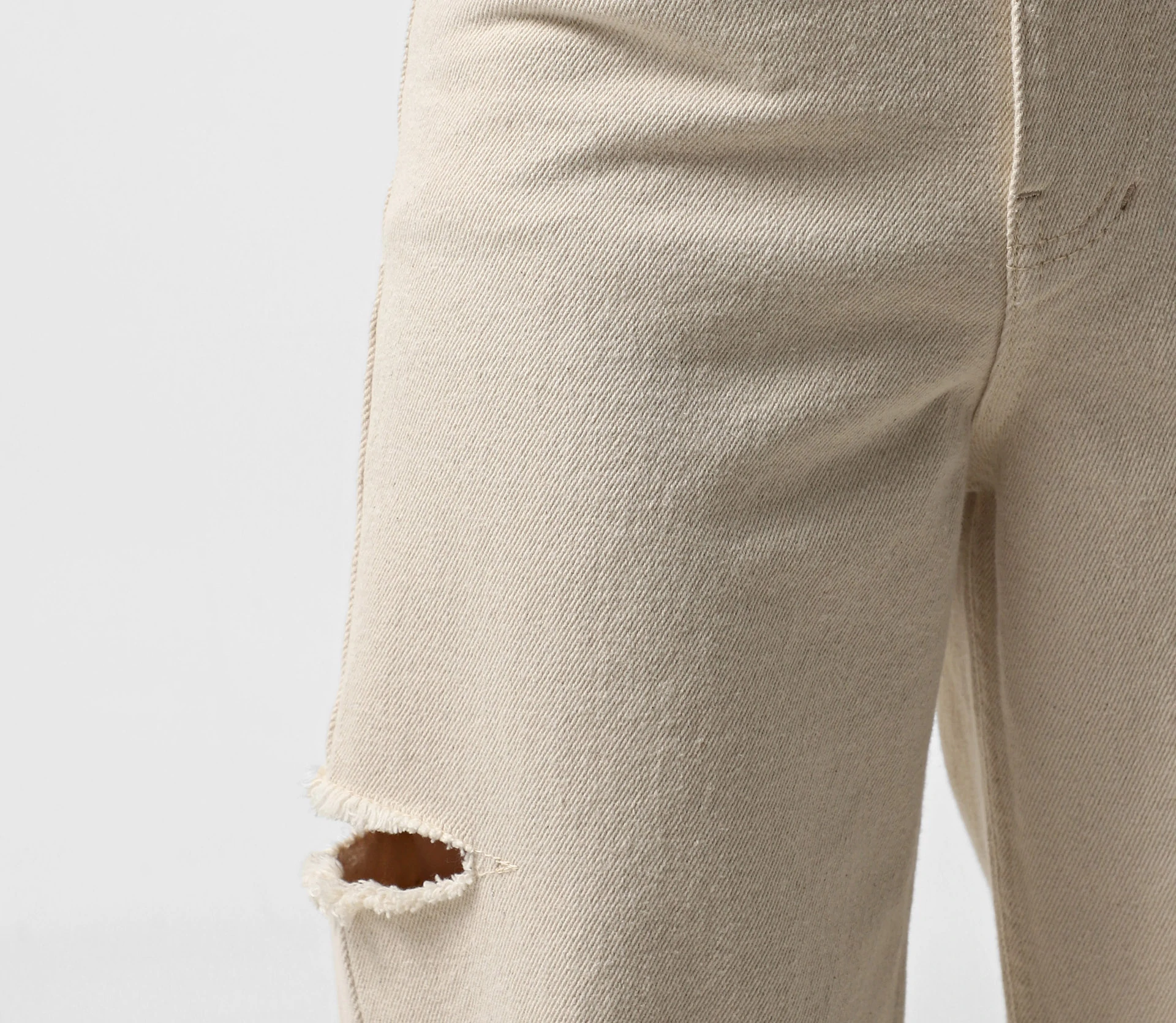 Джинси на високій посадці та розрізами по бокам бежевий - фото №4 Джинси на високій посадці та розрізами по бокам бежевий недорого